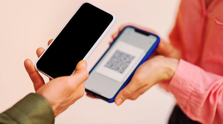 photo of a person scanning a QR code